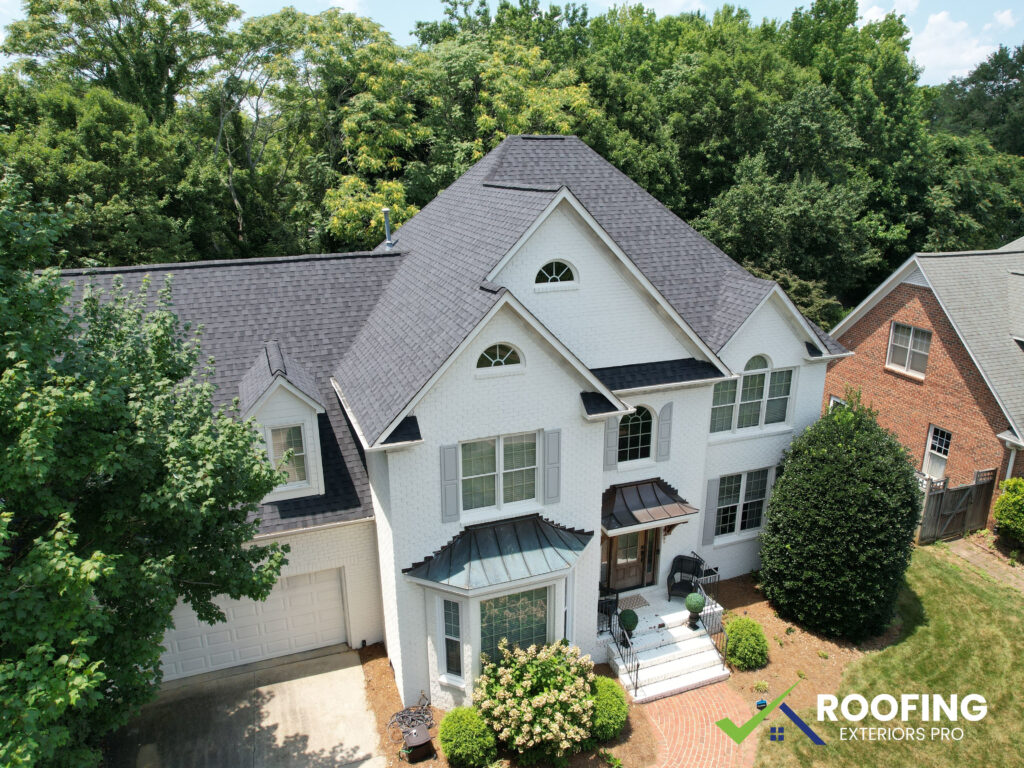 Roofing Exteriors Pro crew completing roof replacement in Greensboro NC with Select ShingleMaster certification